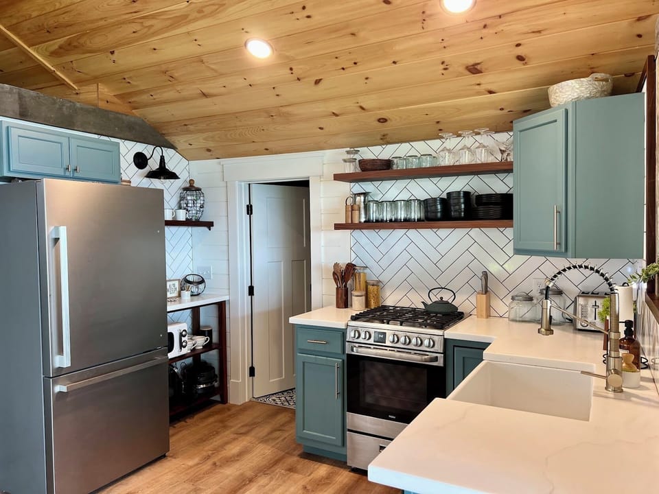 Kitchen with stove, microwave, and keurig coffee maker