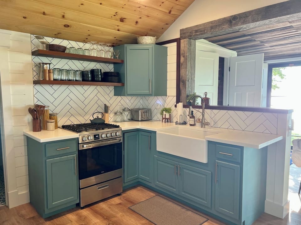 Kitchen with stove, microwave, and keurig coffee maker