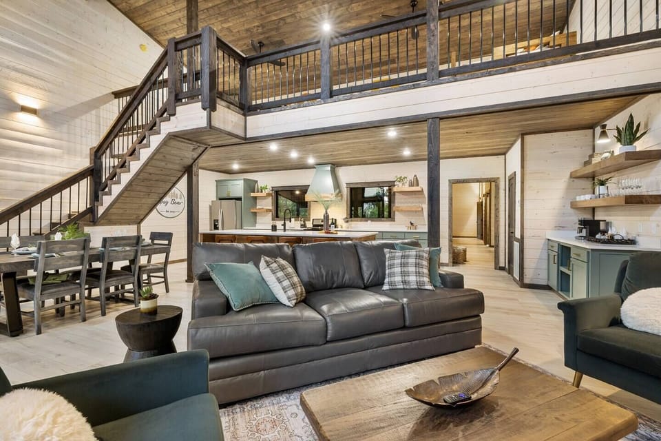 The open-concept floorplan means everyone is part of the action, whether relaxing in the  living room, eating at the dining table, or prepping meals in the kitchen.