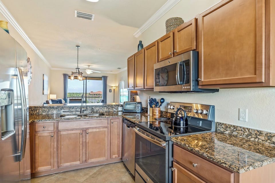 Kitchen overlooks the dining area & living room
