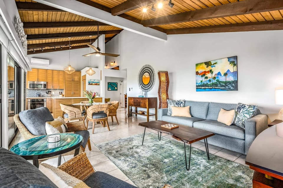 A welcoming spacious living area with plenty of cushions and soft upholstery.