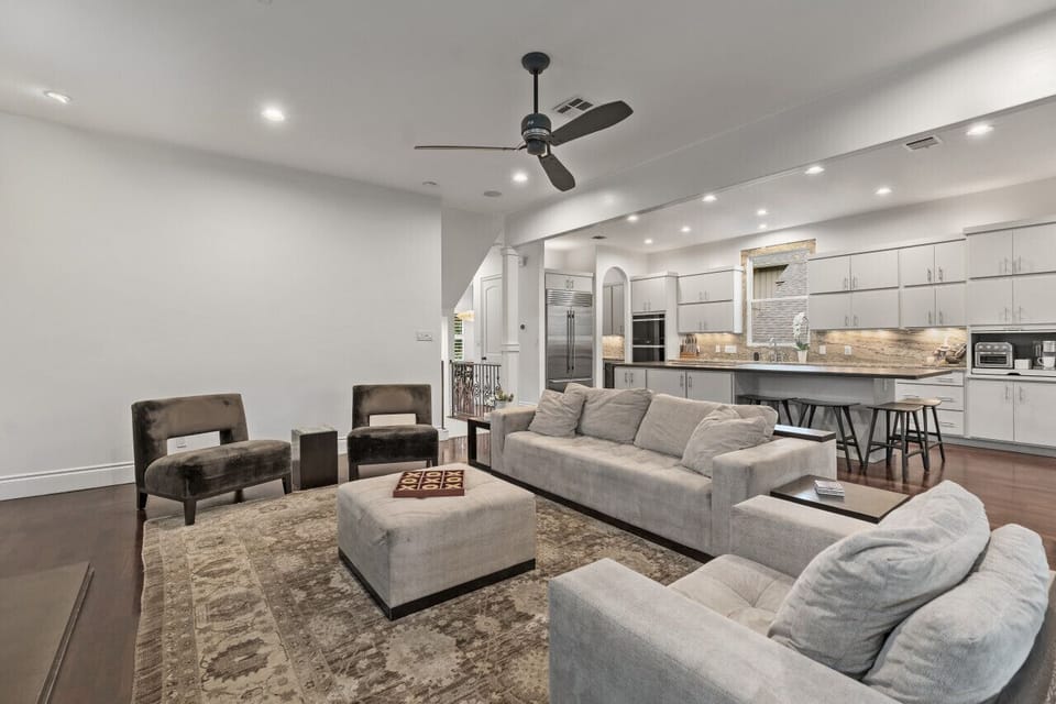 Second giant main living area that opens to covered outdoor living, dining and kitchen