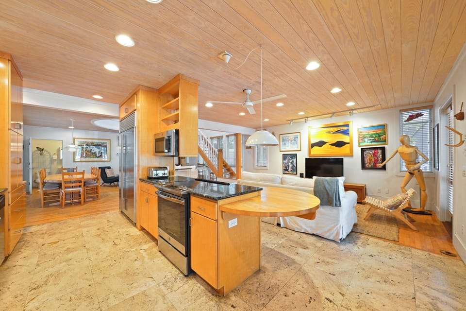 ADJACENT OPEN KITCHEN FROM LIVING AREA