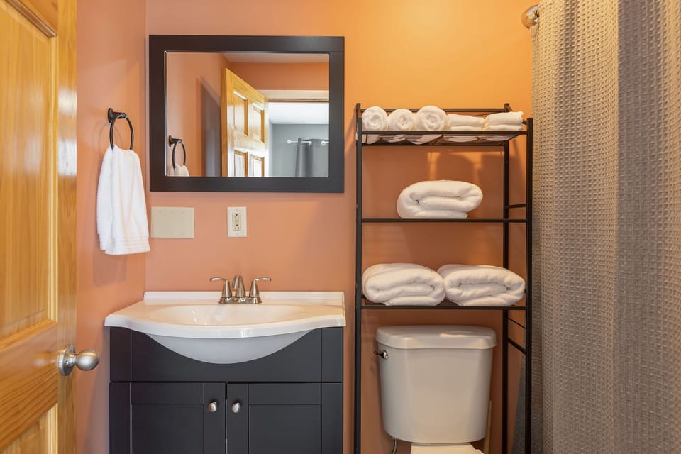 Full bath with combined tub/shower in lower level 