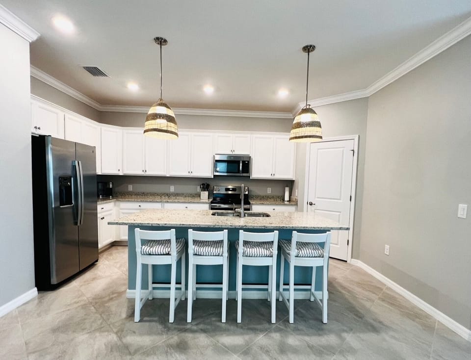 The kitchen in this open concept common area is a chef's delight