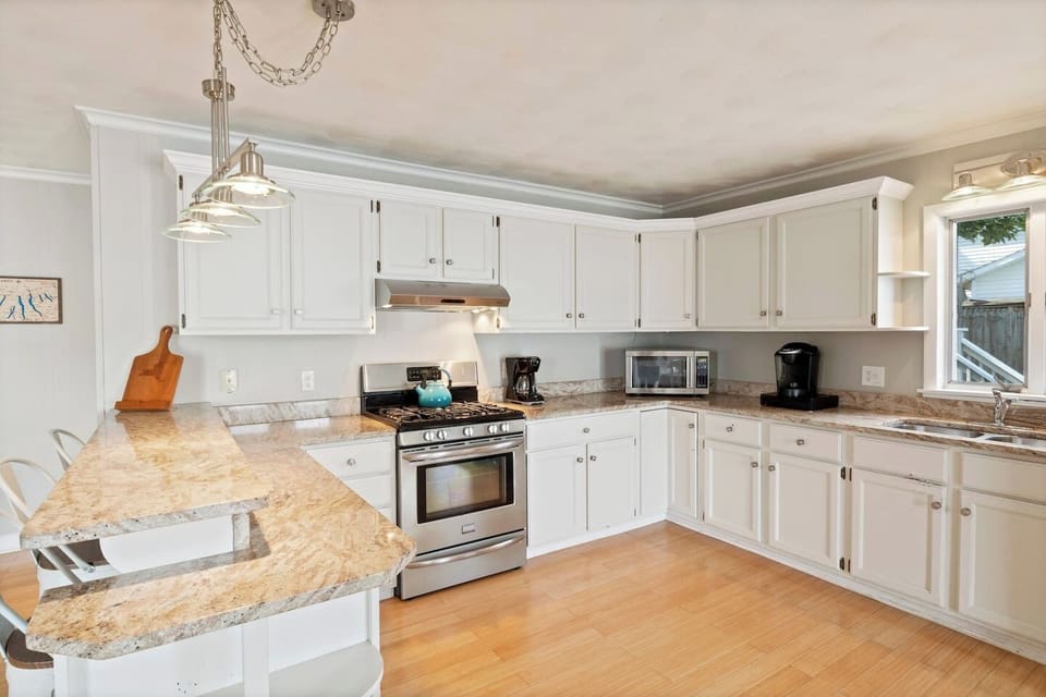 Enjoy the fully stocked kitchen that opens to the living room so you can stay in the conversation while preparing meals.