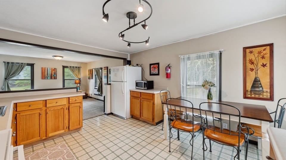 The upstairs kitchen leads into the living room.