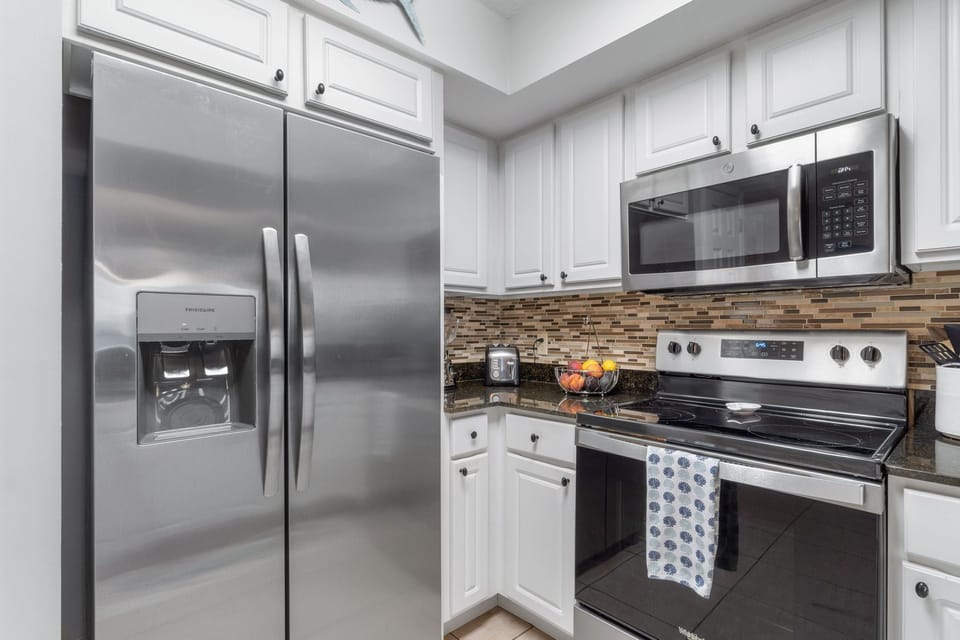 Full size refrigerator & freezer with filtered water and ice maker.