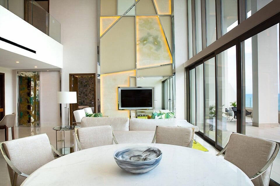 View of living area from dining area (2 story open ceiling)