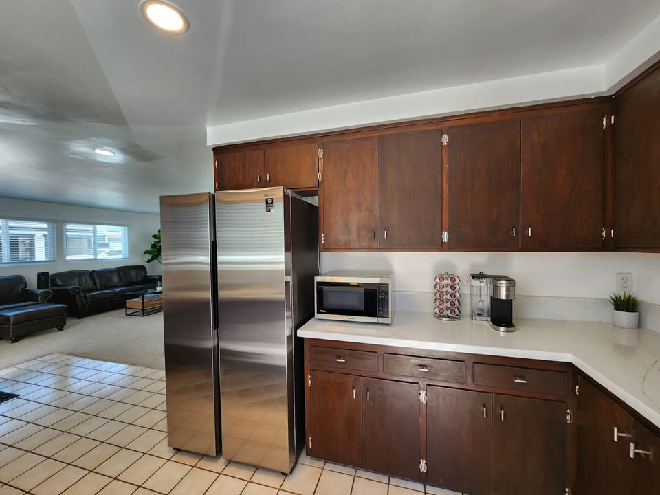 Kitchen is Fully Stocked with Keurig Coffee and Keurig Coffee maker. 