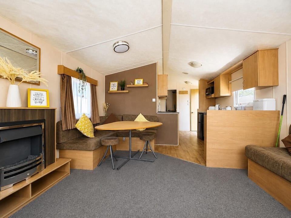 The caravan living room is a welcoming space where families can relax after a day of exploring.