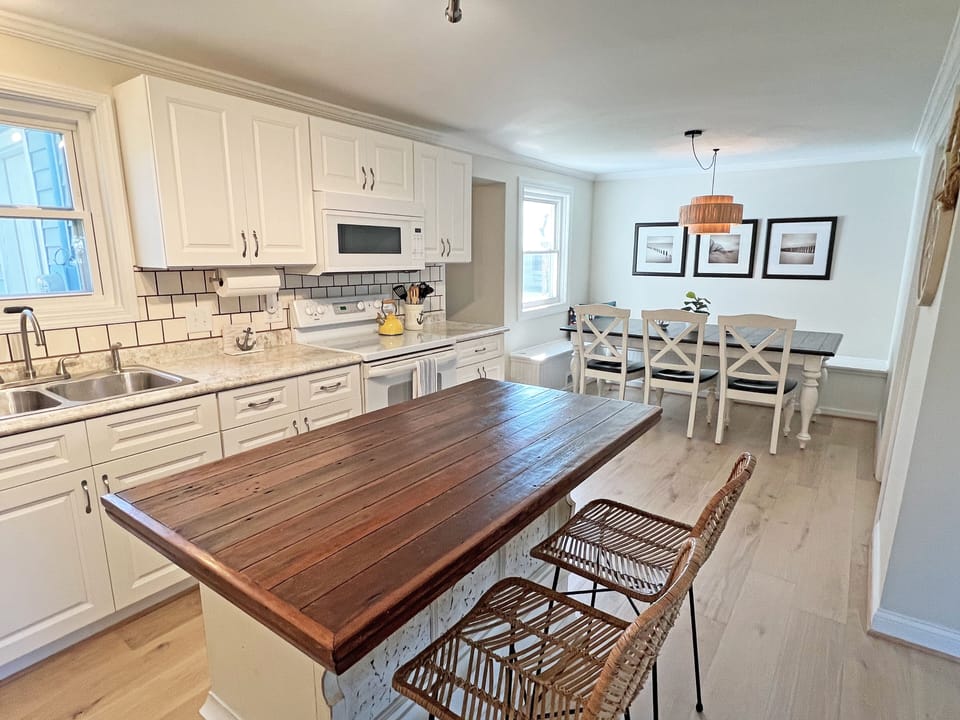 Seating for the entire family between the  kitchen island and large dining table