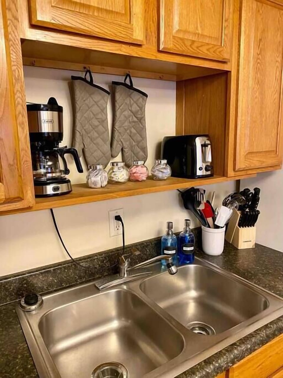 Kitchen is well stocked with appliances and utinsels