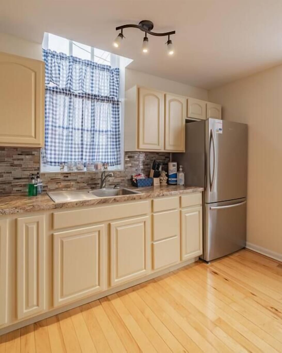 Kitchen well stocked with utensils and appliances