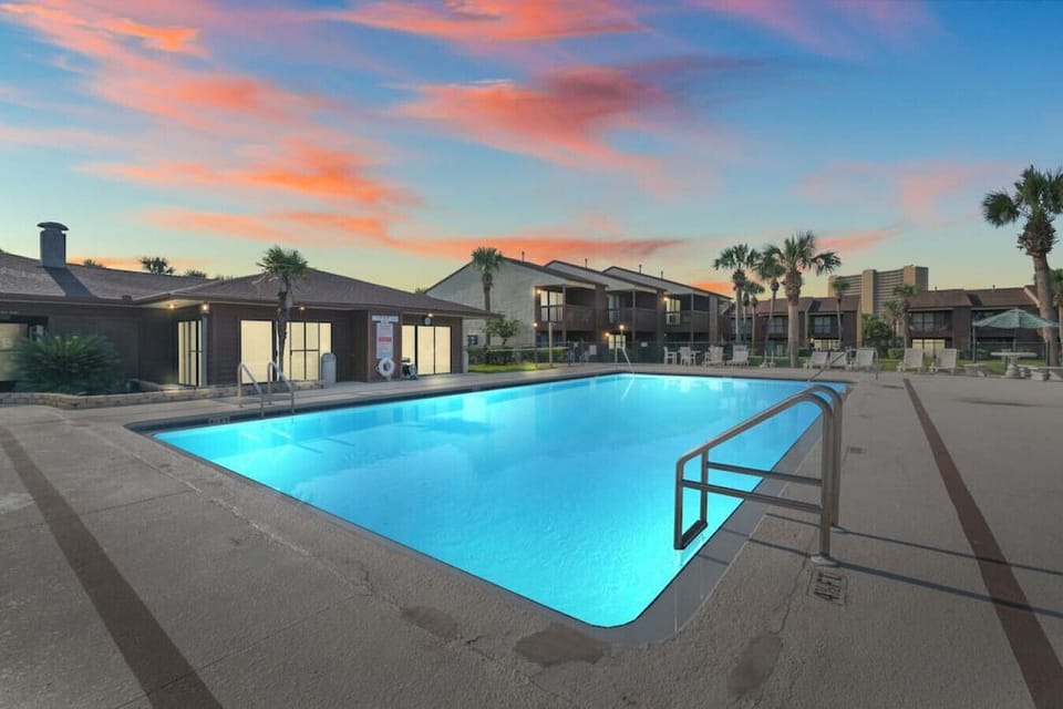 Twilight Tranquility: Our Community Pool, Where Stars Gracefully Reflect on the Water!