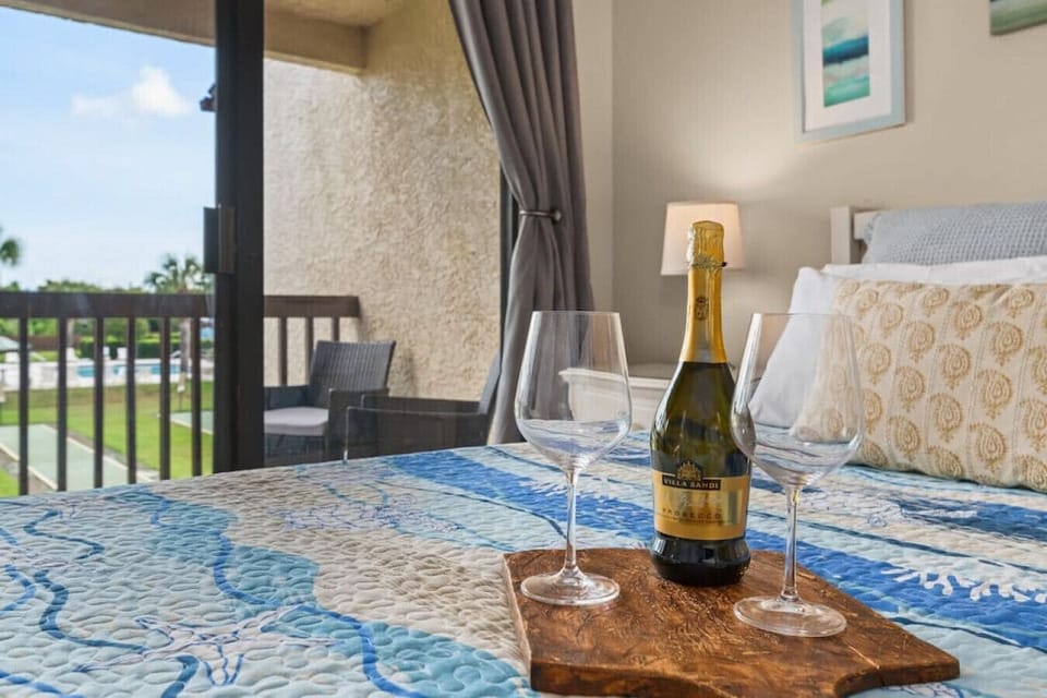 Bright and spacious king bedroom upstairs! Wine not included, but relaxation is guaranteed!