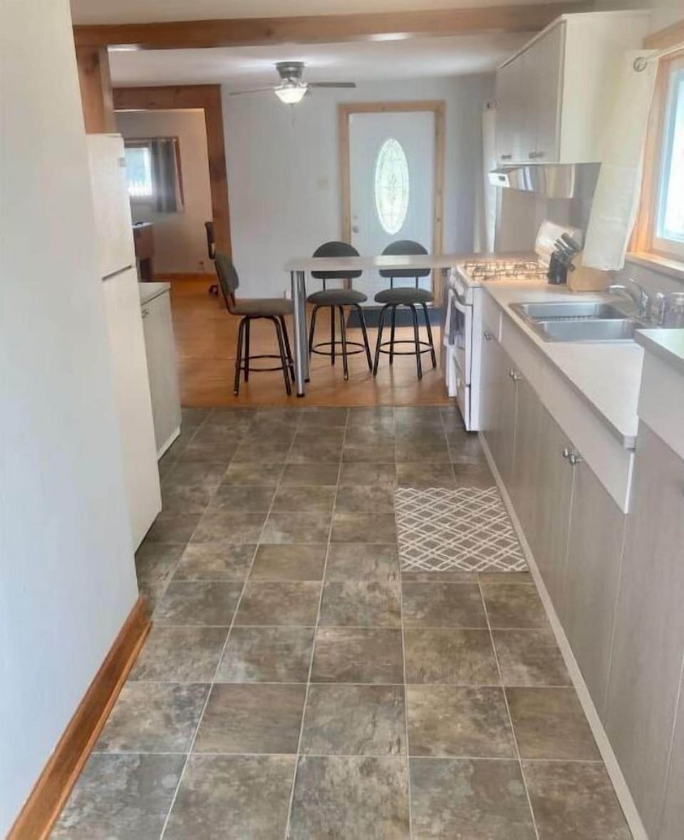 Kitchen with lots of cabinet space. Dishes, pots and pans provided.
