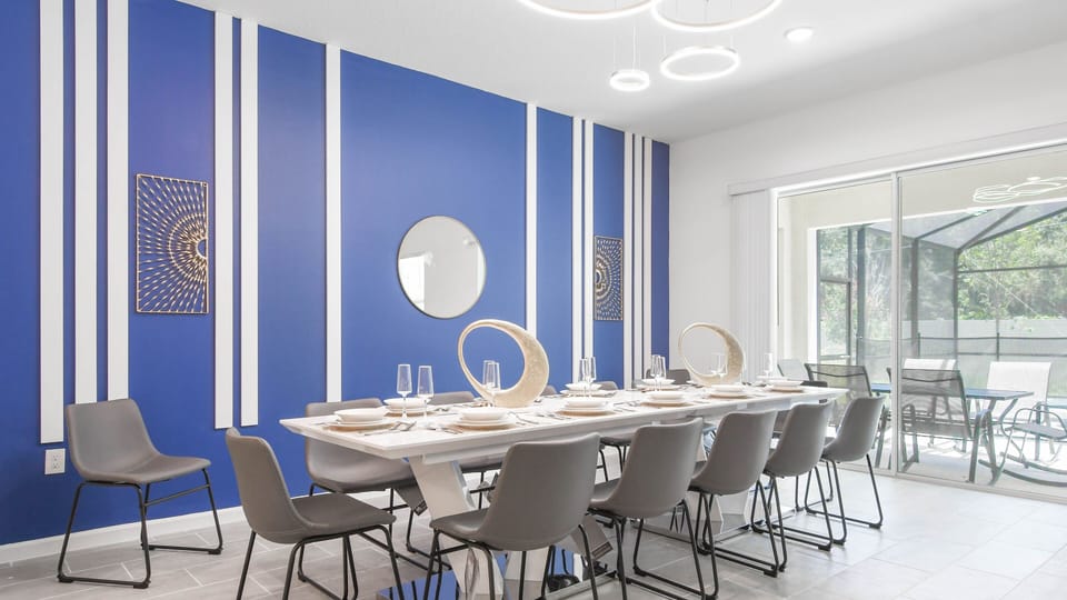 Host memorable family dinners in this spacious dining area, complete with stylish decor and ample seating for everyone to enjoy.