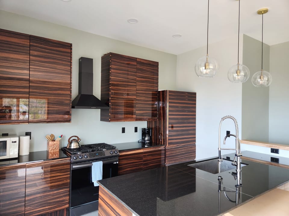Gourmet kitchen with granite counters offers beautiful views while cooking.  