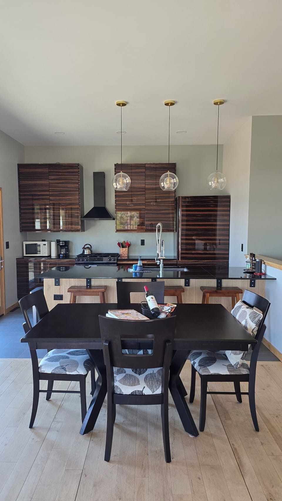 Open concept kitchen, dining, and living room area.