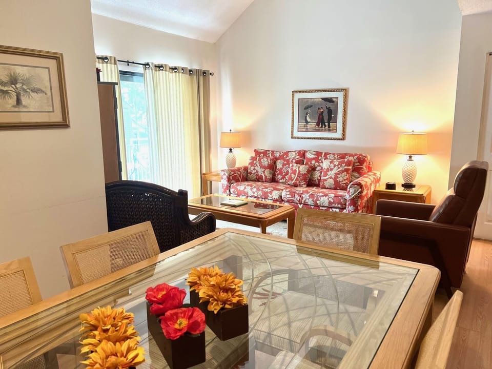 Unwind on the comfortable floral sofa or the plush leather recliner after a fun day on the island.