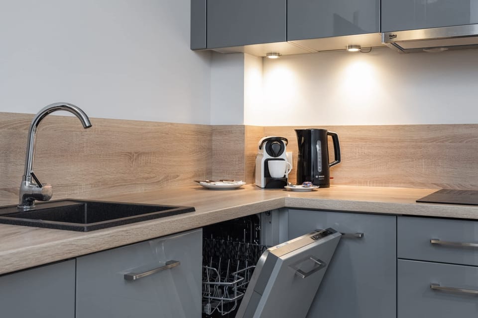 Another angle of the kitchen, highlighting its sleek design and convenient layout for cooking and dining.





