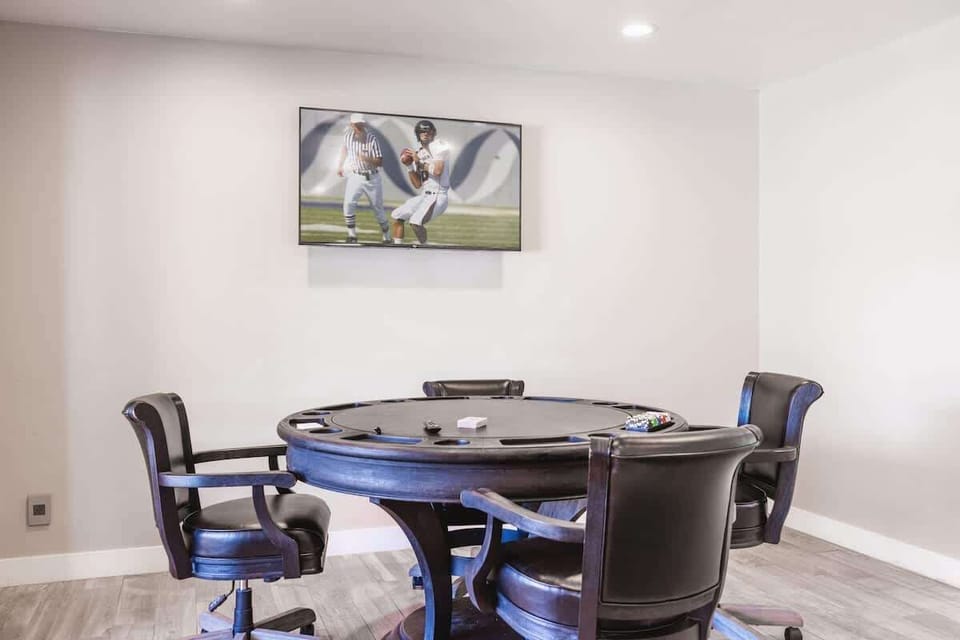 Game room with poker table and leather chairs for serious card nights