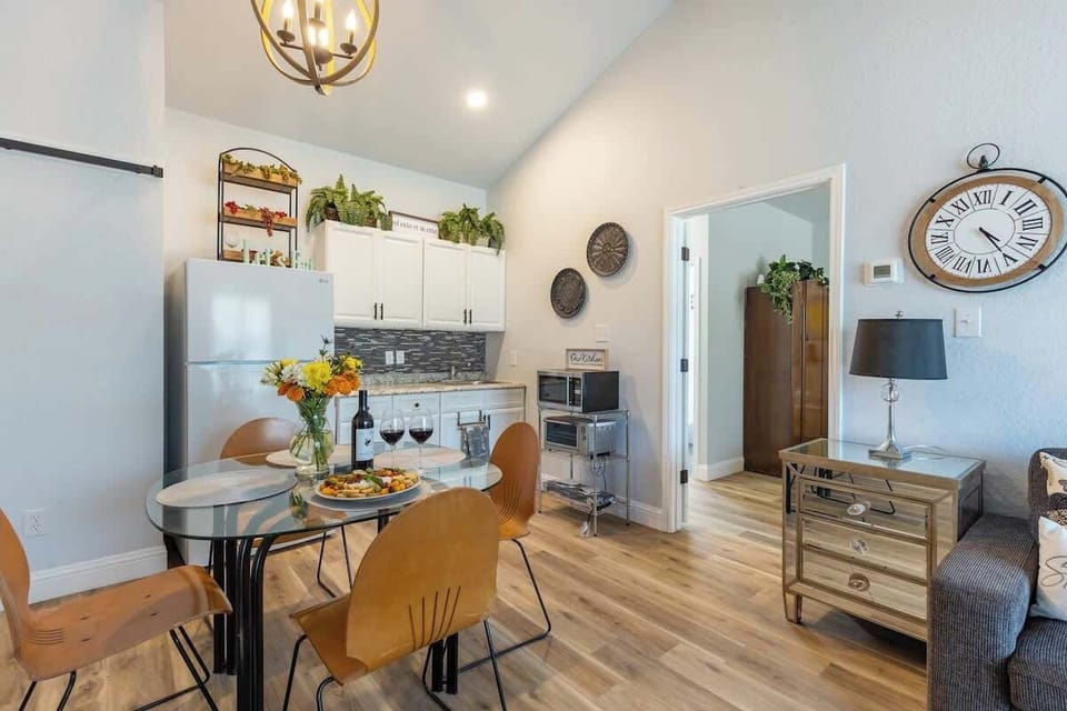 The dining table for four provides a perfect setting for intimate meals and shared conversations in a cozy and welcoming space.
