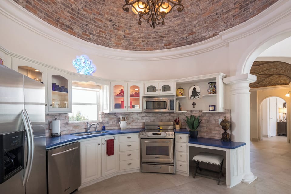 Kitchen w/ Stove, Fridge, Wine Cooler, Dishwasher, Ice Maker, and Microwave.