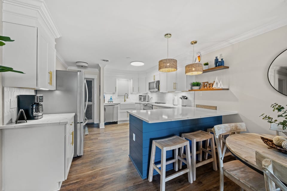 The kitchen island provides additional counter space for serving snacks or meals