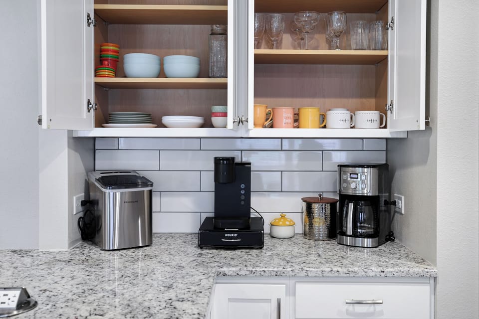 Ice machine and various styles of glasses. 