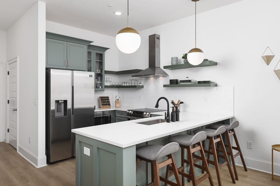 Seating for 4 at the kitchen counter, perfect for cooking & convening over a meal.