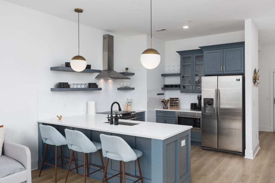 Fully-stocked kitchen for all your cooking needs! There is also a separate high-top dining table with seating for 4.