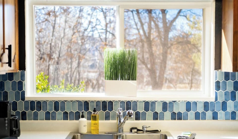Bright kitchen sink with garden view