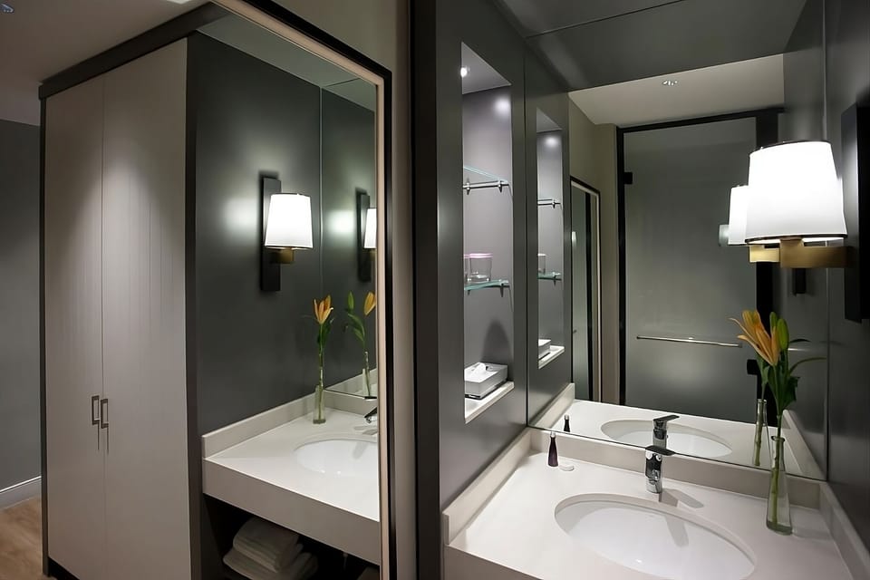 Get ready effortlessly with double reflections and soft sconce glow.