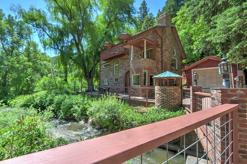 View of creekside home from bridge 