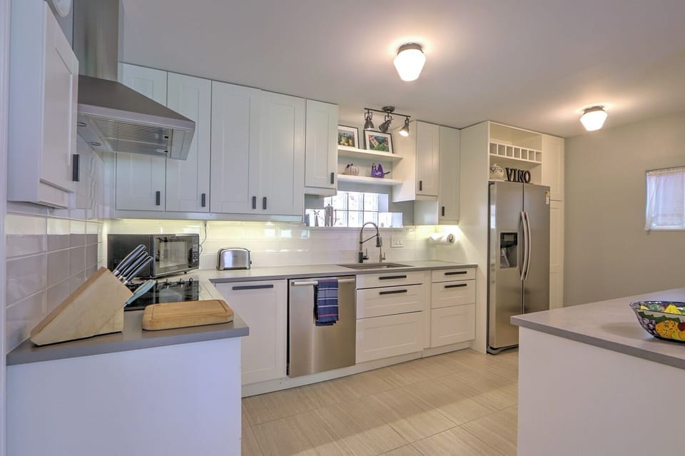Modern kitchen with sleek counters and new stainless appliances