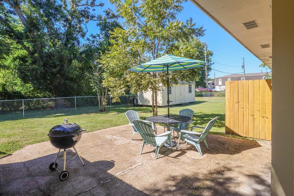 Private fenced in backyard with large patio