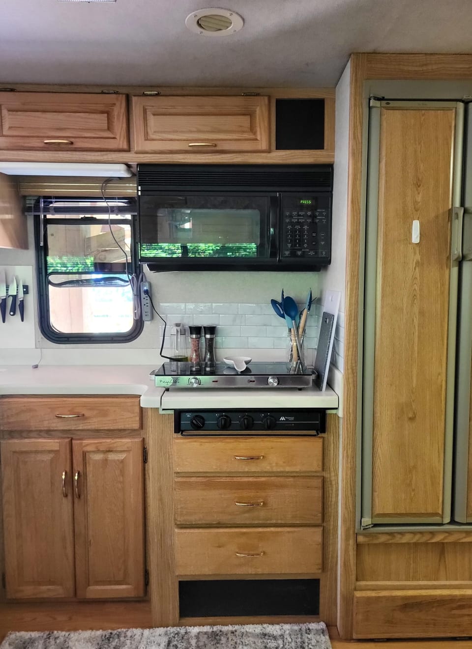 Kitchen area has a spacious fridge. BBQ on the deck.