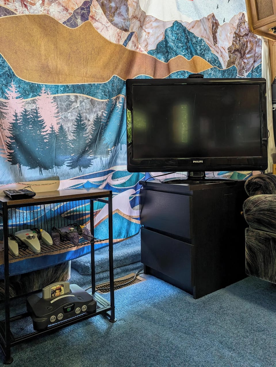 TV in living room is connected to a Nintendo 64, as well as a ROKU to watch apps