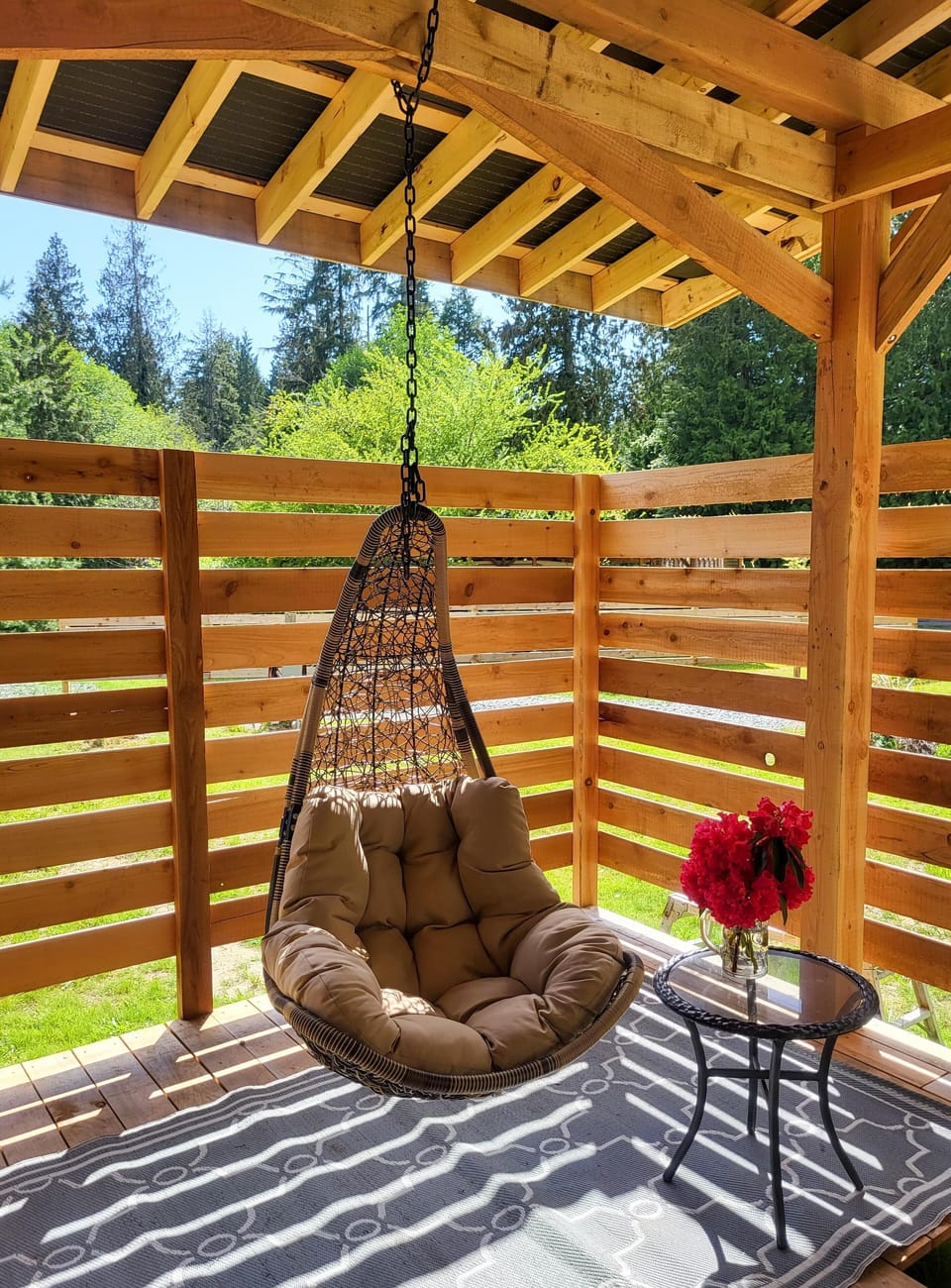 Cozy hanging chair on the fully covered deck.