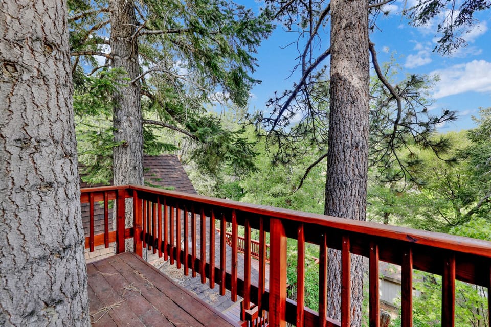 Outdoor space with a BBQ, hot tub, and comfortable seating, perfect for relaxing and enjoying peaceful evenings outside.