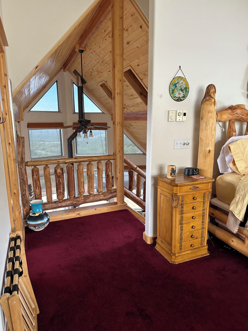 Entry into the master bedroom loft.  No door between the stairs and the room.