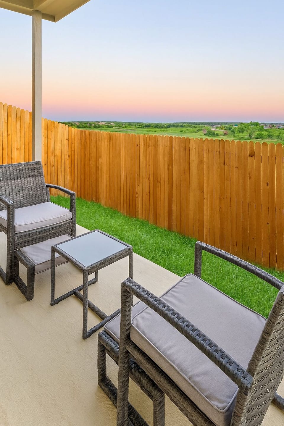 Private back yard with a beautiful view of the adjacent grassy field. 