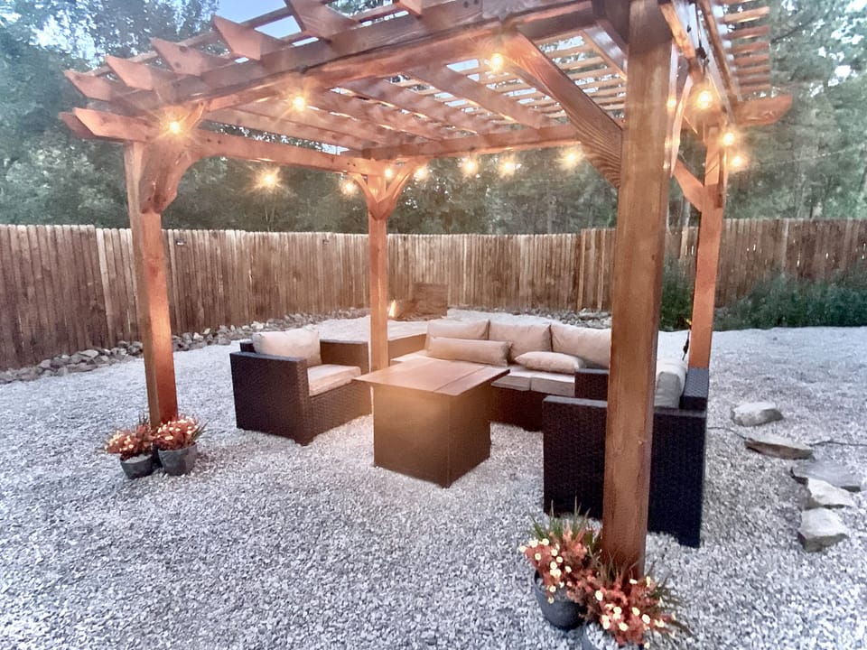 Pergola in the spacious backyard that is fully fenced and private.