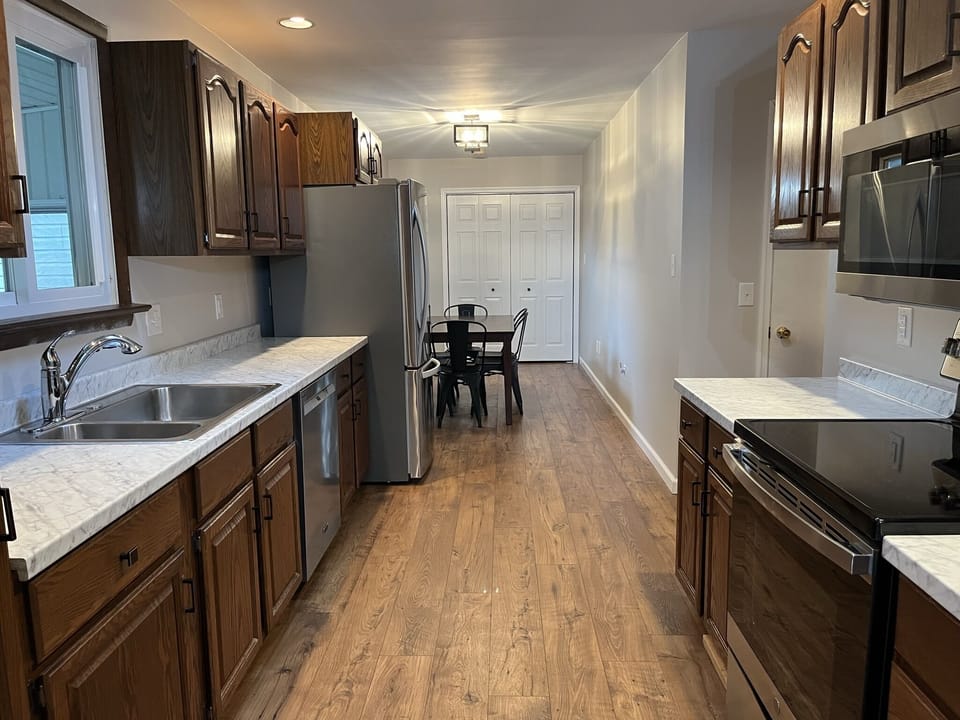 Fully stocked kitchen with dining area.