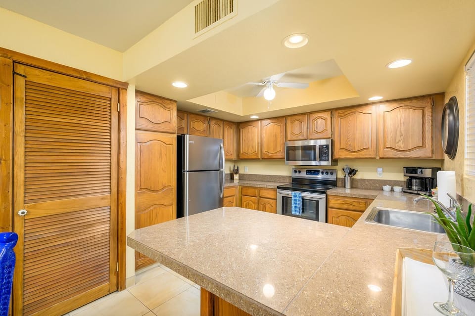Kitchen area has all pots, pans, dishes and glassware.