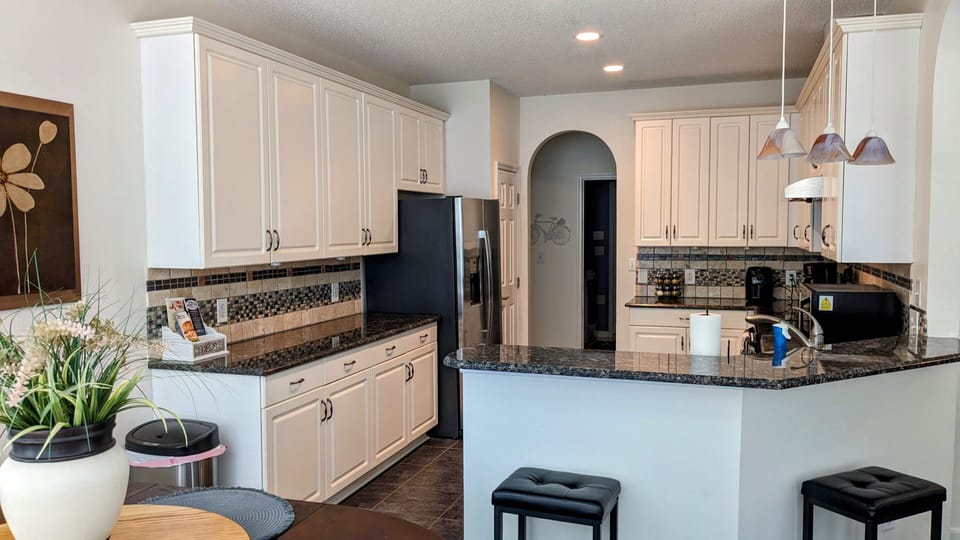 A large kitchen that opens up to the sitting room allows families to be together
