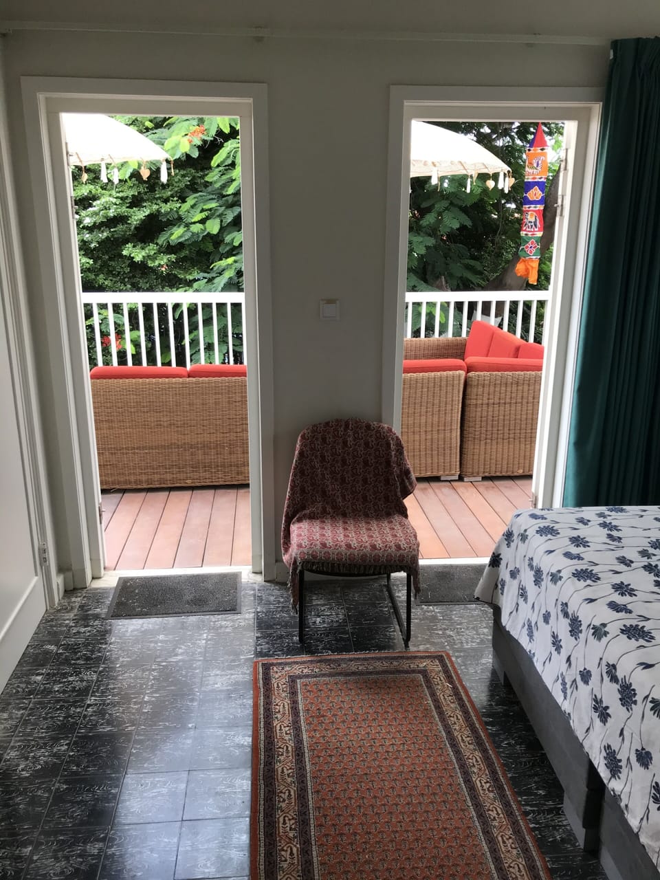 main bedroom connected to a private deck.