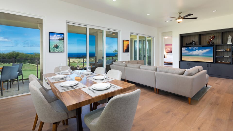 Spacious contemporary open concept living / dining room with ocean views